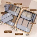 Travel organizer set in light grey with mesh breathable bags packed in a suitcase - Gray 8-Piece Set