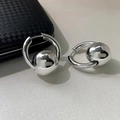 Macro detail of polished silver ball drop earrings with engraved BEEENGAGE branding - Hoop Ball Style (A0421B) / Silver