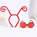 Macro shot of red plush insect headband with curled antennae and honeycomb textured glasses - Red Ant Headband + Red Glasses
