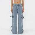 Detail of light blue cargo jeans showing large utility pockets and ribbon tie accents - S / Light Blue