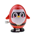 Cute red penguin clockwork toy with Christmas theme and walking mechanism on white background - Wind-up Walking Oval Penguin Red