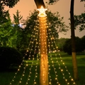 Outdoor solar star waterfall lights with warm white LED strings hanging on a tree - Star Solar Remote Control / Warm White