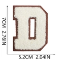 Macro detail of 7cm chenille letter D patch with cream embroidery and brown felt base - Letter D