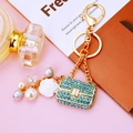 Elegant blue rhinestone handbag keychain with white camellia and pearl charms on gold ring - Sky Blue Pearl Handbag