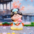 Miniature Tang dynasty girl figurine in yellow and white hanfu holding a pink lotus - Holding Lotus Style / 【product Attributes】this Product Is A Q-version Traditional Chinese Lady-style Figurine/figure. The Lady Is Dressed In A Yellow-white Gradient Hanfu Draped In An Orange-red Shawl Wearing A Light Blue Floral Hair Ornament Holding A Pink Lotus Flower And Has A Serene Expression. The Material Appears To Be Resin Or Pvc. 【visual Presentation】the Image Uses Exquisite Miniature Real-scene Photography. The Product Is Placed In The Center Of An Antique Stone Slab Ground With A Blurred Background Of Chinese Garden Architecture. The Color Scheme Is Fresh Harmonious And Has A Sense Of Breathability. Image Quality Is [high] With Accurate Focus And Saturated Colors. Aesthetic Appeal Is [high] With An Overall Score Of [8.8] And Strong Visual Appeal. 【text Content】there Is No Text In The Image. Based On Grouping: No Watermark No Marketing Rhetoric And No Text Related To The Product Itself. 【logistics Labels】none. 【infringement Risk】product Infringement: None As It Is A Generic Chinese Style Creative Design. Background Infringement: None. 【product Parameters】specific Parameter Information Is Not Indicated In The Image.