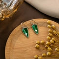 Detailed shot of vintage green leaf earrings with pearls on a rustic wooden tray - E5853-Silver Retro Green Leaf Pearl