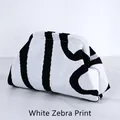 Knit dumpling clutch bag featuring classic white and black zebra stripes pattern - White and Black Irregular (Zebra Print)