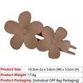 Matte pink double flower hair clip with dimensions 10.3cm x 5.6cm and lightweight design - Brown