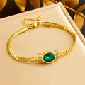 Gold-plated herringbone bracelet featuring oval green zircon and sparkling accent stones - Emerald Green Stone Duo (B1406)