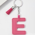 Detailed view of pink PU leather letter E keychain with matching tassel and silver ring - Pink-Letter E