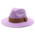 Detail of purple woven fedora straw hat featuring a wide brown ribbon and fine texture - Taro Purple