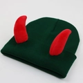 Close-up of dark green knitted beanie featuring red plush devil horns on white background - Adult One Size - Elastic / Red Horn - Dark Green Hat