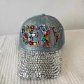 Close-up of light blue denim cap with colorful SEXY rhinestones and diamond-studded brim - Adjustable / Denim No.2 (Pale Blue)