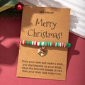 Detailed view of Christmas wish bracelet with colorful clay beads and festive wreath charm - Christmas Wreath