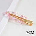 Macro shot of a 7CM acetate hair clip with pink star sequins and golden metal base - 60# Acetate 7cm Seamless Clip