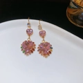 Close-up of golden heart earrings with pink gemstones and colorful crystal border - Ear Hook Style (5803585102201) / Gold-Pink-Multicolor