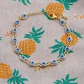 Bracelet œil porte-bonheur doré avec détails en émail coloré et chaîne réglable - Blanc
