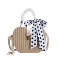 Fashionable straw shoulder bag with white faux leather handle and polka dot silk scarf detail - White