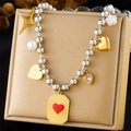 Detailed shot of layered metallic bracelet with star, heart, and pearl charms on soft pad - Star/Flower/Heart/Letter A Style (N3249)