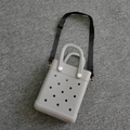 Minimalist grey EVA crossbody bag with circular vent holes and black shoulder strap - Gray