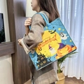 Blue Halloween felt tote bag with pumpkin and ghost prints held by a model in a home setting - 34*27*12cm / Blue