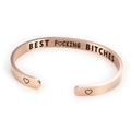 Macro shot of rose gold C-shaped cuff bracelet with heart and text engraving - Rose Gold G3345-BEST F♡CKING BITCHES