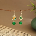 Detail of emerald green bamboo leaf and flower earrings with long gold tassels - Flower Bamboo Leaf (E6449)