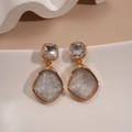 Detail of vintage geometric earrings with gold frame and grey ice-cracked resin texture - Clear