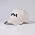 Close-up of TALES 3D embroidery on cream cotton baseball cap with twill texture - Beige
