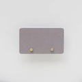 Close-up of yellow birthstone stud earrings in silver four-claw setting - November: Yellow