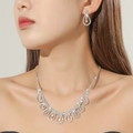 Elegant silver bridal jewelry set with sparkling rhinestones worn by a model - Simple Necklace Earrings Silver Set(DTN14026458S)