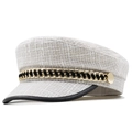Detail of cream tweed newsboy cap featuring a gold chain and textured woven fabric - 56-59cm / Off White