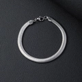 Sleek silver stainless steel flat herringbone snake chain bracelet on black background - 21cm / Silver/6.0mm Flat Snake Chain