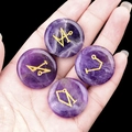 Set of four purple amethyst rune stones with gold engraved symbols held in palm - Set of 4 / Amethyst