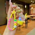 Cute bunny liquid quicksand milk tea cup keychain with yellow silicone strap and gold bell - Yellow StellaLou Milk Tea Cup