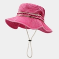 Close-up of pink washed canvas sun hat featuring distressed ribbon and adjustable wind cord - Rose Red