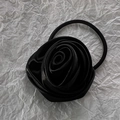 Detail of elegant black rose hair tie on a textured white paper background - Large / Black