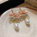 Detail of pink rose earrings with iridescent bows and teardrop pearl pendants - Pink Rose Iridescent Bow Pearl Earrings (21#)