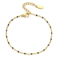 Detail of bohemian gold chain bracelet featuring black enamel beads and lobster clasp - Gold Black