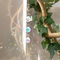 Close-up of golden moon suncatcher with crystal balls reflecting rainbow light effects - B24 Style