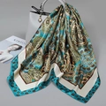 Blue and olive paisley print square satin scarf draped over a grey leather handbag - 90cm X 90cm / Emerald