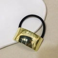 Minimalist black elastic hair tie featuring a polished gold U-shaped alloy metal buckle - Smooth Arc - Gold
