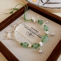 Bracelet ajustable en perles vertes avec breloques papillon et bambou en argent - Ensemble de 4 Pièces Vert Argent