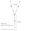 Detailed view of silver stainless steel Y-necklace with oval link and tassel design - Silver