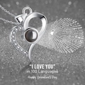 Silver heart projection necklace featuring I Love You in 100 languages on glitter background - White Gold Heart Necklace