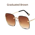 Gafas de sol sin montura con lentes degradadas té y montura metálica dorada ondulada - Degradado Marrón