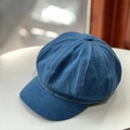 Close-up of vintage dark blue denim newsboy cap showing texture and stitching detail - One Size / Medium Blue & White