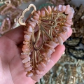 Close-up of golden butterfly hair claw clip with pink orange crystal gravel detailing - Sunstone Gold Butterfly