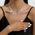Elegant bridal jewelry set with sparkling crystals necklace and earrings on a model - 658+840 3-Piece Set (Necklace+Bracelet+Earrings) / Silver