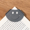Grey leather heart-shaped bookmark with smiley face cutout for book corners - Gray